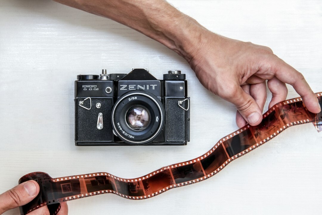 film reel next to digital camera