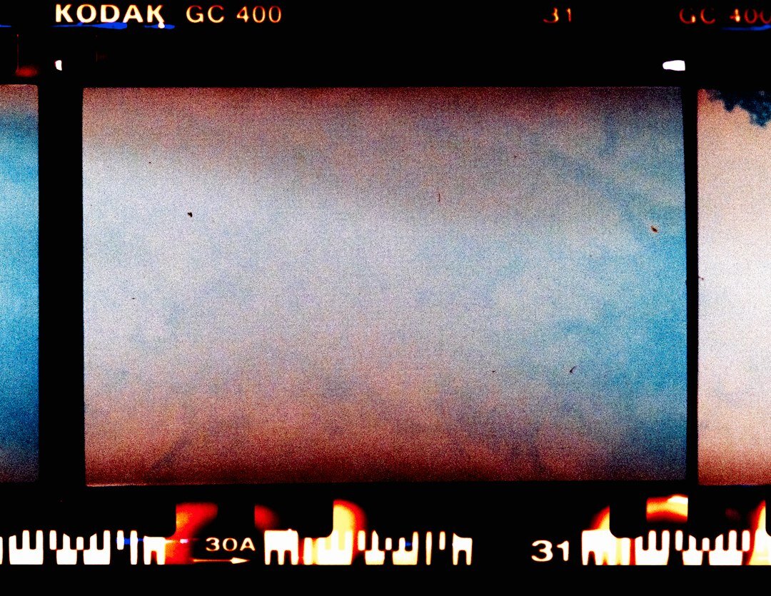 film reel next to digital camera