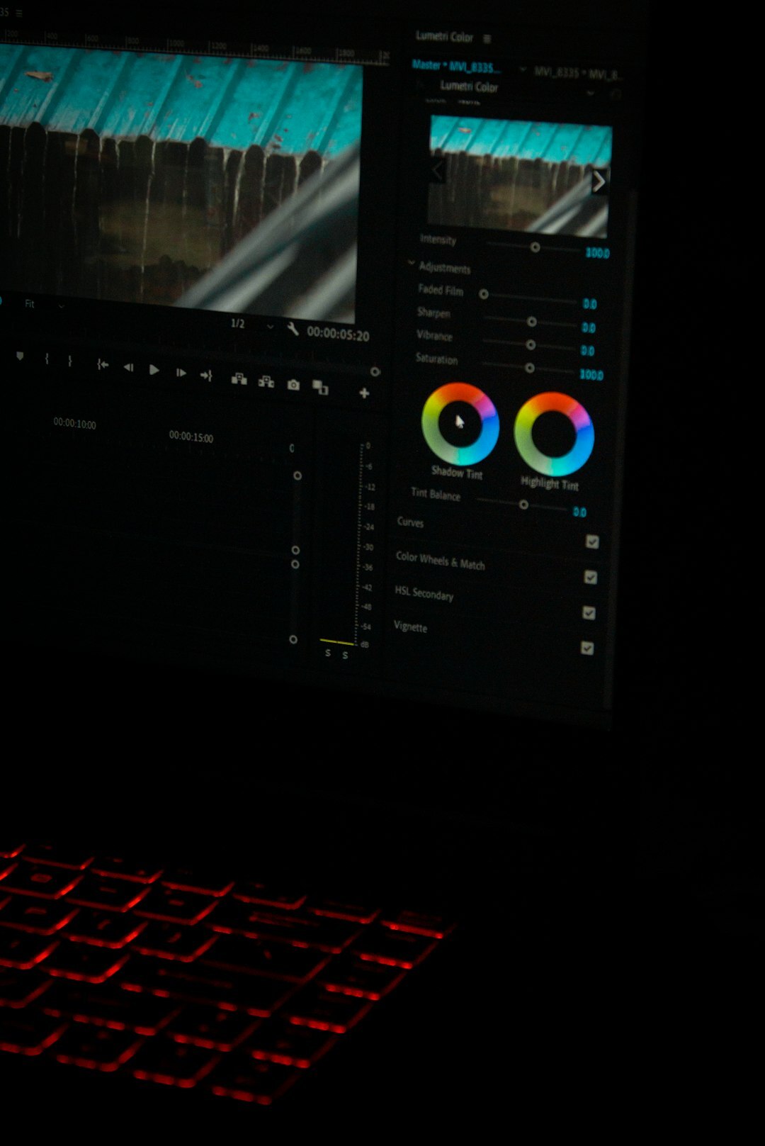 filmmaker editing video on laptop